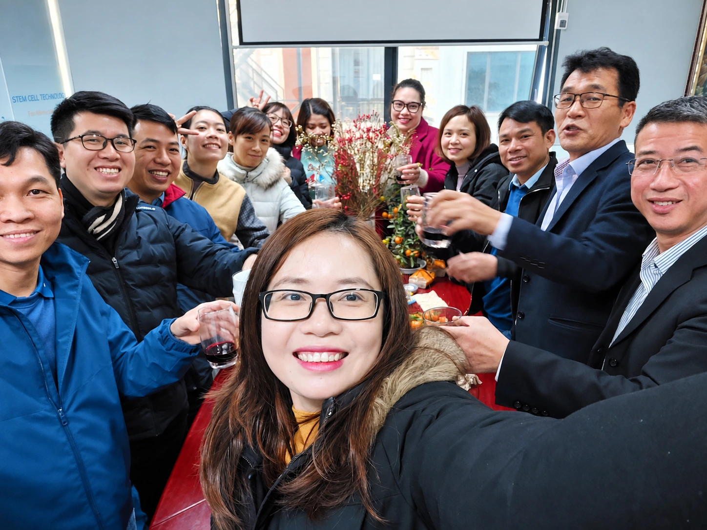 A group selfie of colleagues during an office gathering